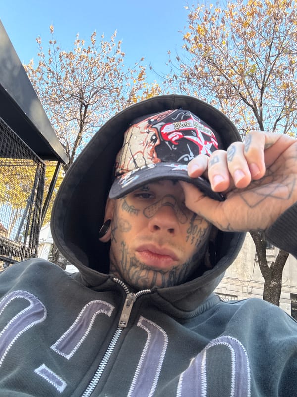 Heavily tattooed person documented in Buenos Aires with social posts