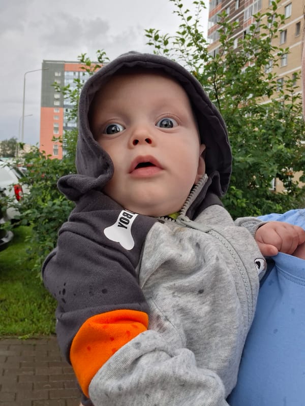 Rainy afternoon at a Perm residential playground, July 2026