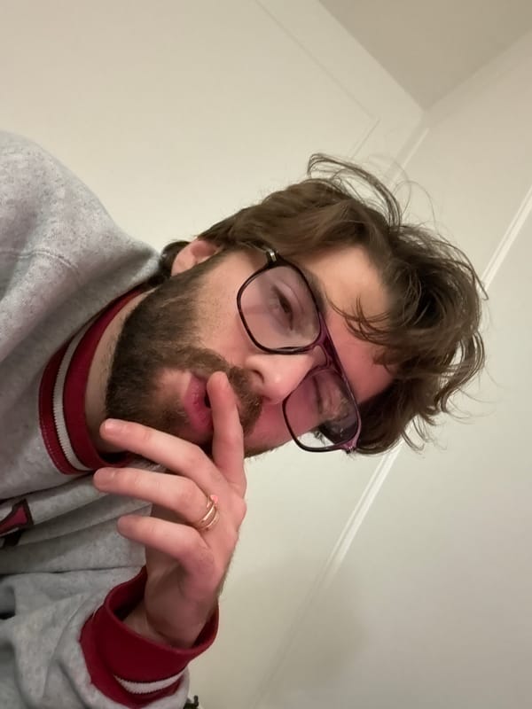 Man takes late-night selfie in minimally furnished Montreal apartment