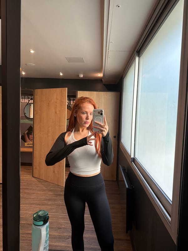 Woman takes selfie in skylit Paris building