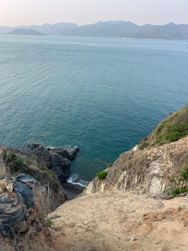 Tourist captures clifftop coastal views at Vietnam heritage site