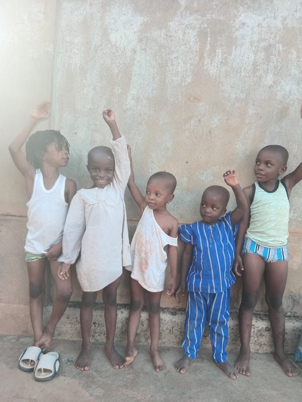 Children photographed in residential Shagamu, Nigeria neighborhood