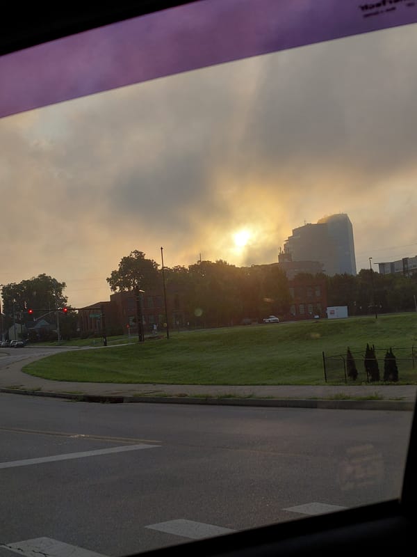 Hazy Lexington morning, power lines and glass towers from the road