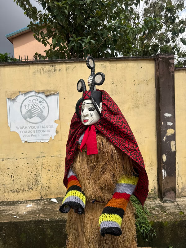 Traditional masquerade figures gather in Alagba, Nigeria