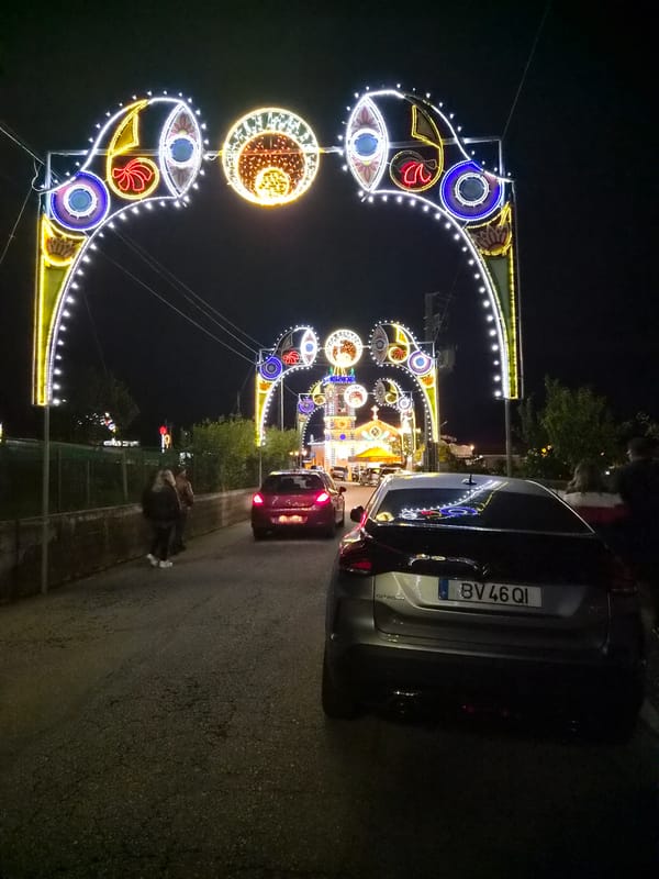 Nighttime festival with music and lights illuminates Barcelos, Portugal