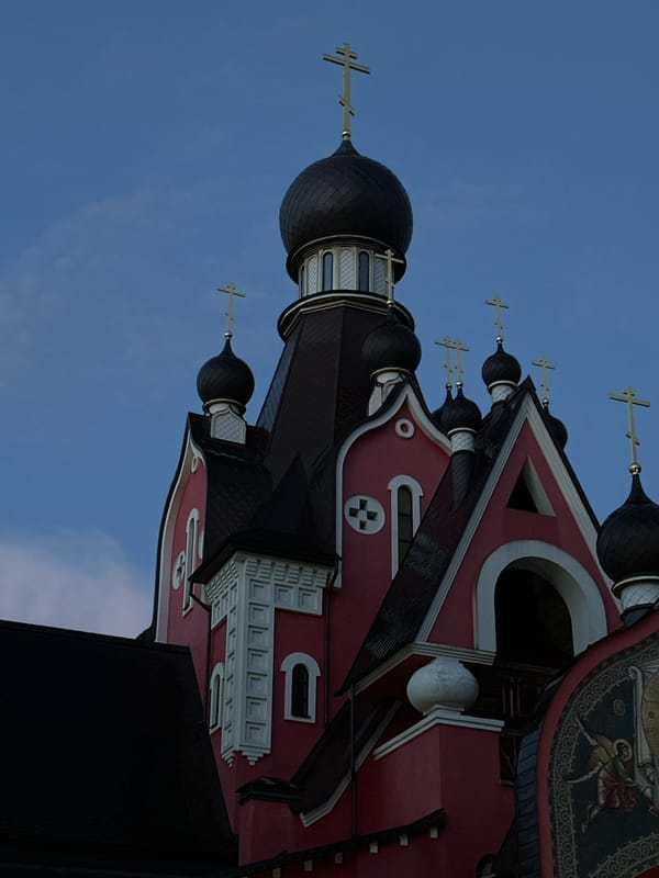 Rainy summer dusk in Zhdanovichi: scooters, a church, and quiet streets
