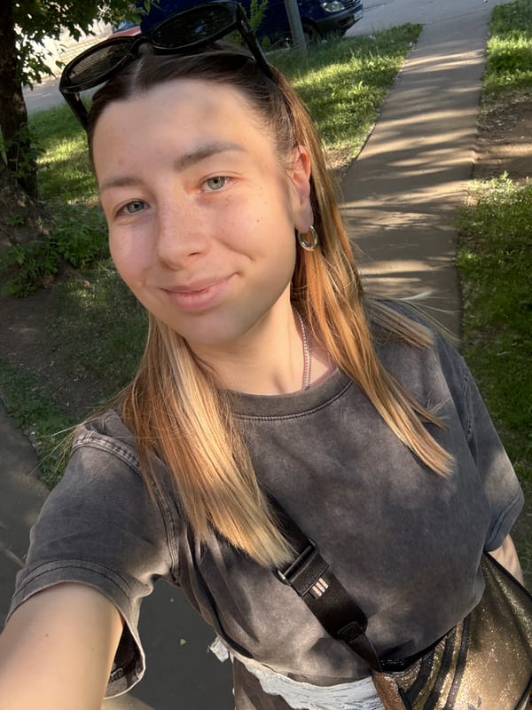 Woman Takes Multiple Selfies in Moscow During Afternoon Session