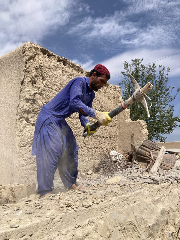 Workers demolish structures at Qilla Saifullah construction site