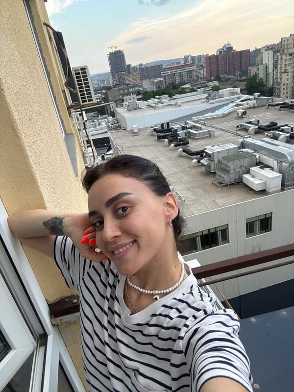 Afternoon in Tbilisi: balcony views, city skyline, and a cat