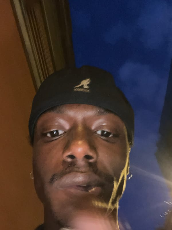 Unidentified person photographed multiple times in Barcelona evening