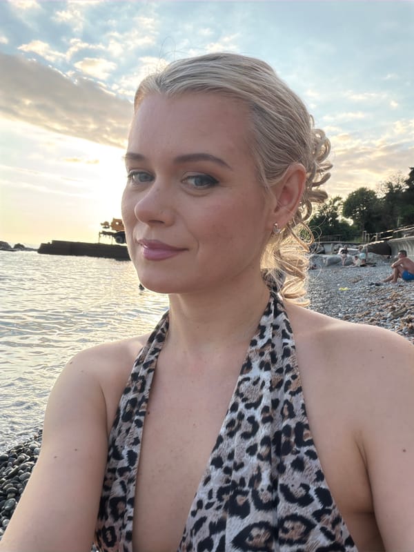 Sunset selfies on a Sochi pebble beach, leopard print and curls