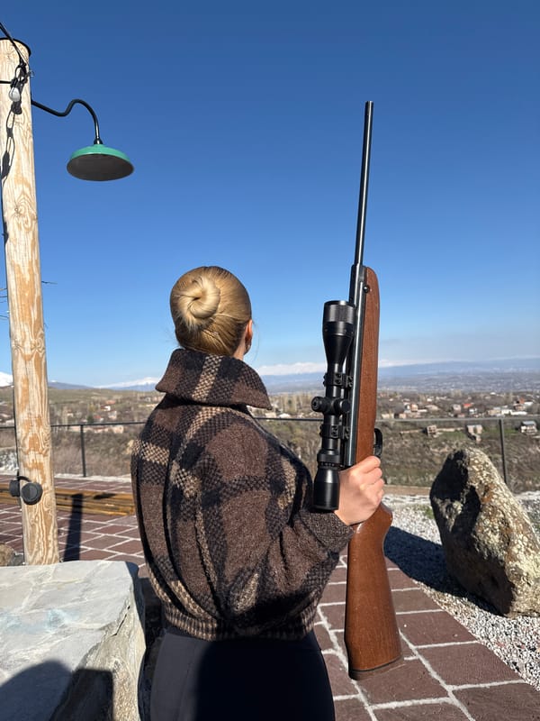 Woman with rifle spotted in outdoor scene in Byurakan