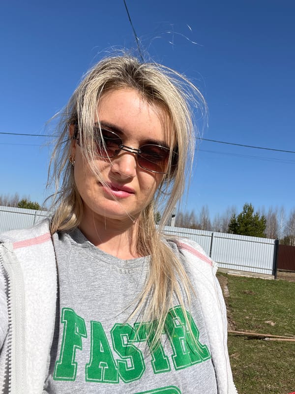 Woman takes selfie near outdoor grill in Гаревая, Russia