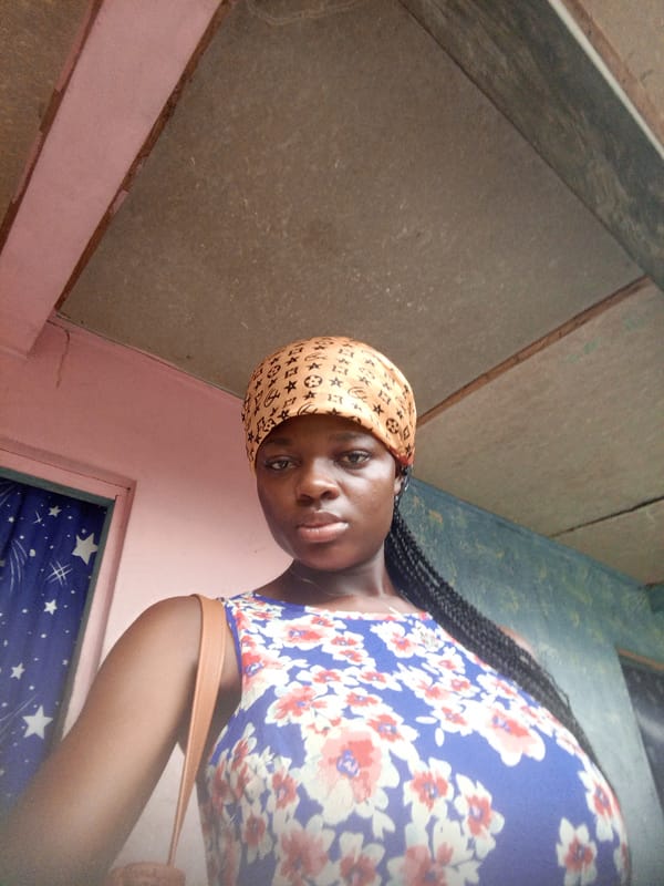 Woman photographed in traditional dress in Mbribit, Nigeria