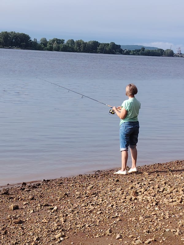 Riverside fishing day on a Russian riverbank, summer 2026