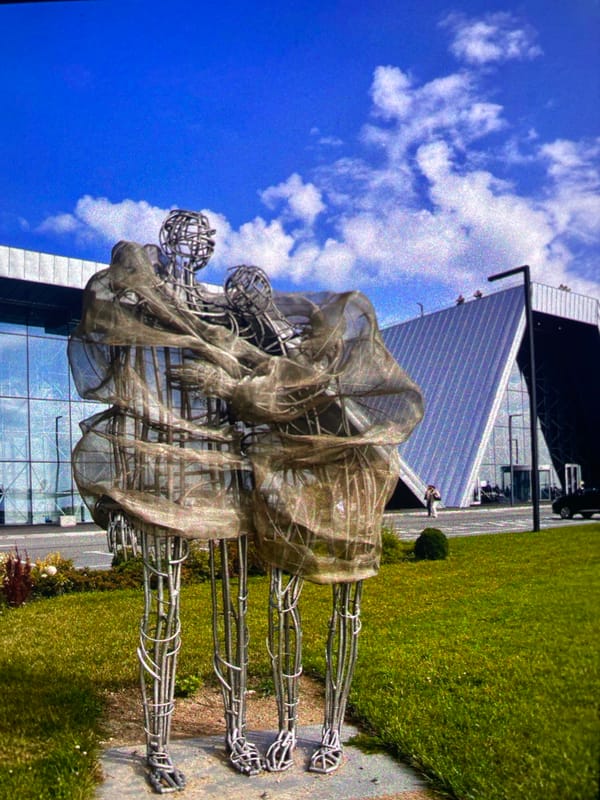 Metal sculpture of intertwined figures observed in Saint Petersburg