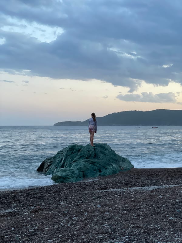 Evening beach gathering captured in Rafailovići, Montenegro
