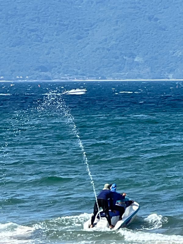 Jet skis, swimmers, and a Da Nang beach morning