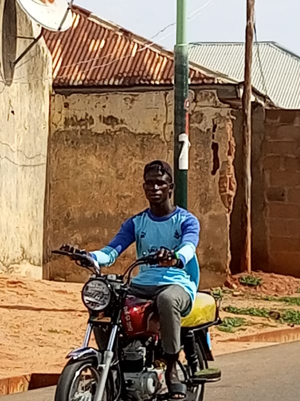 Everyday street life moving through Tempure, Nigeria