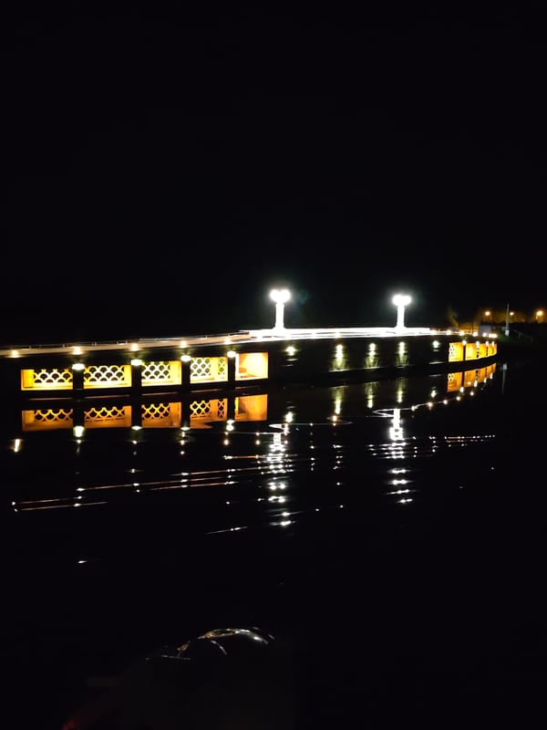 Illuminated bridge captured at night in Karmanovo, Russia