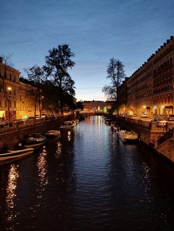 Evening canal life captured across Saint Petersburg during white nights