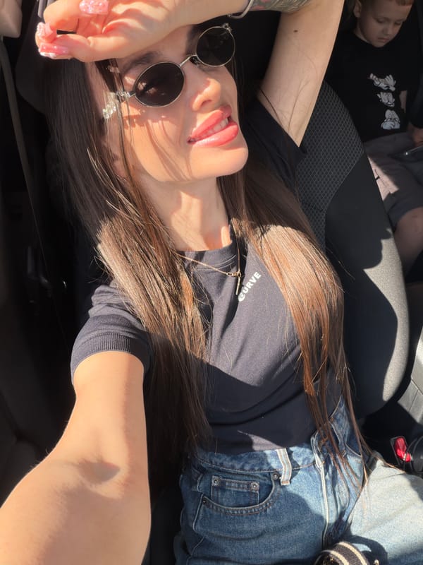 Woman and child photographed during sunny car ride in Izhevsk