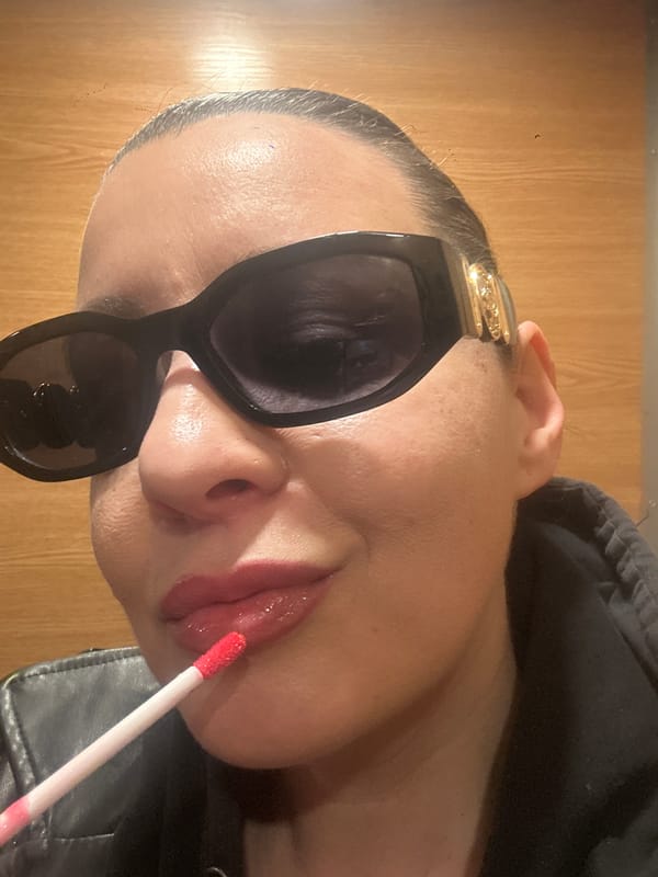 Person films beauty video on Riga sidewalk