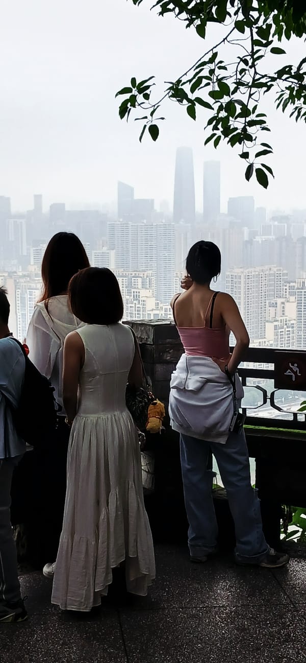 Tourists gather at misty Yuzhong District viewing platform