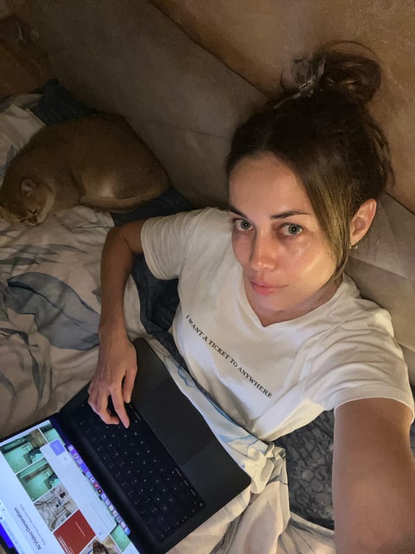 Woman uses AI video software while wearing travel-themed shirt