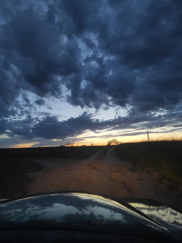 Aurora Colorado witnesses document stormy sunset, vintage cars
