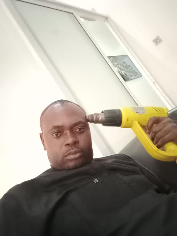 Man photographed in various poses inside Gwarinpa residence
