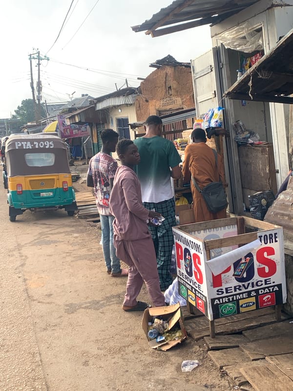 Street activity along a busy Jos–Gura Top corridor