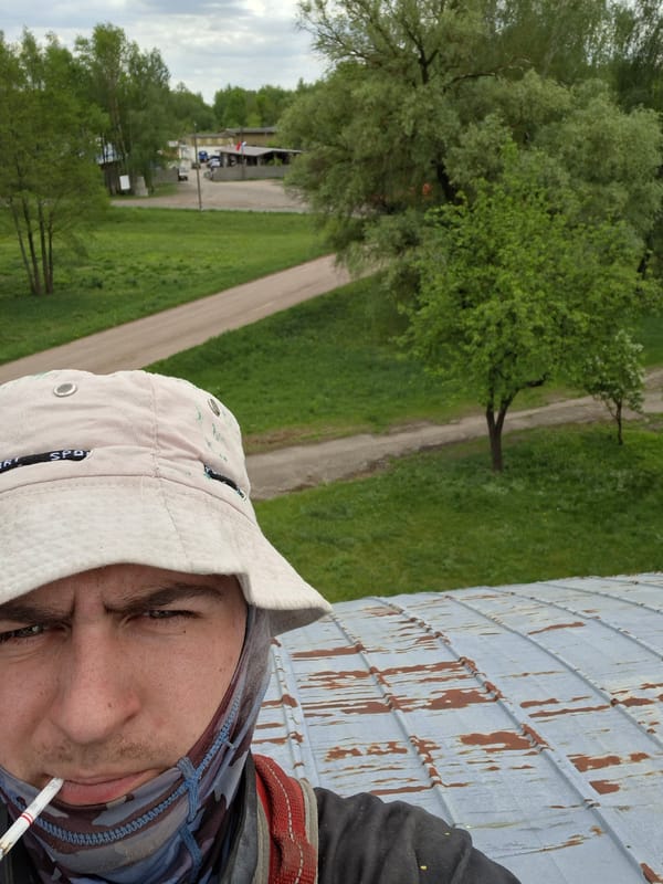 Worker documents maintenance activities at Belarus agricultural equipment yard