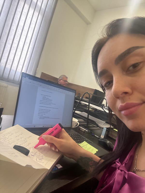 Woman documents work session with Georgian notes in Tbilisi