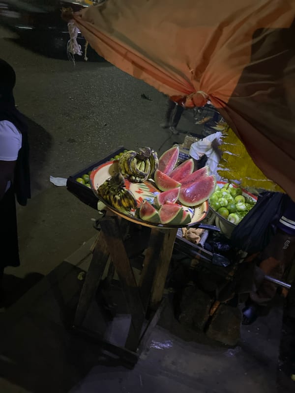 Night market vendors serve grilled meat in Bukuru Nigeria