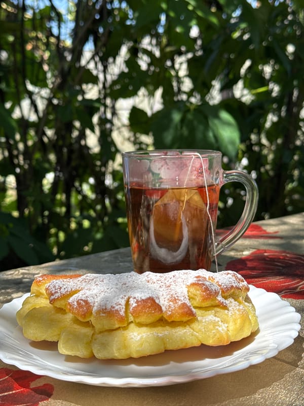 Pastry and tea on a floral tablecloth in Prokopyevsk