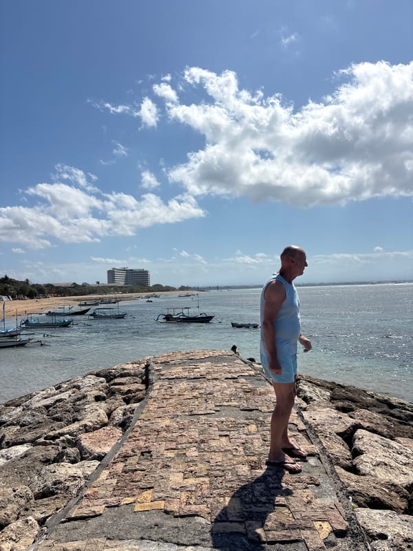 Sunny morning stroll along Denpasar's stone beachfront walkway