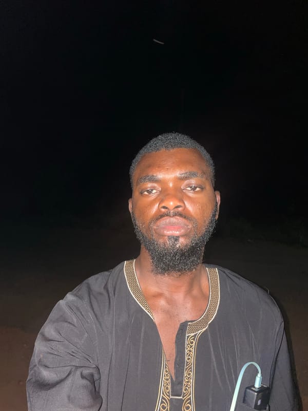 Nighttime photos capture two people together in Ogbe, Nigeria