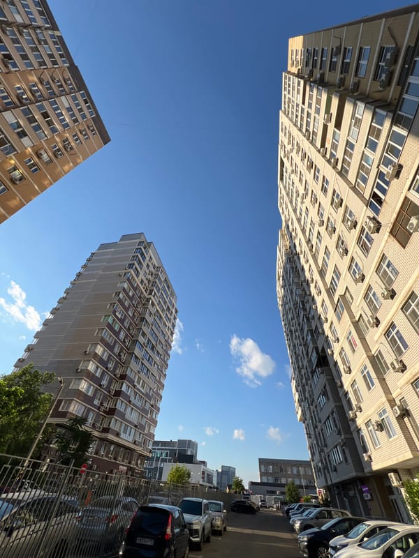 Afternoon street life across a Krasnodar neighborhood