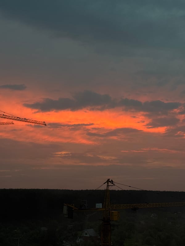 Cranes and apartment towers at sunset in Izhevsk
