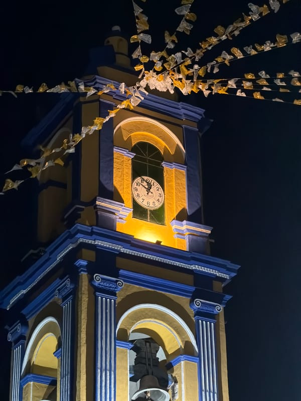 Night photography captures illuminated towers in San Andrés Cholula
