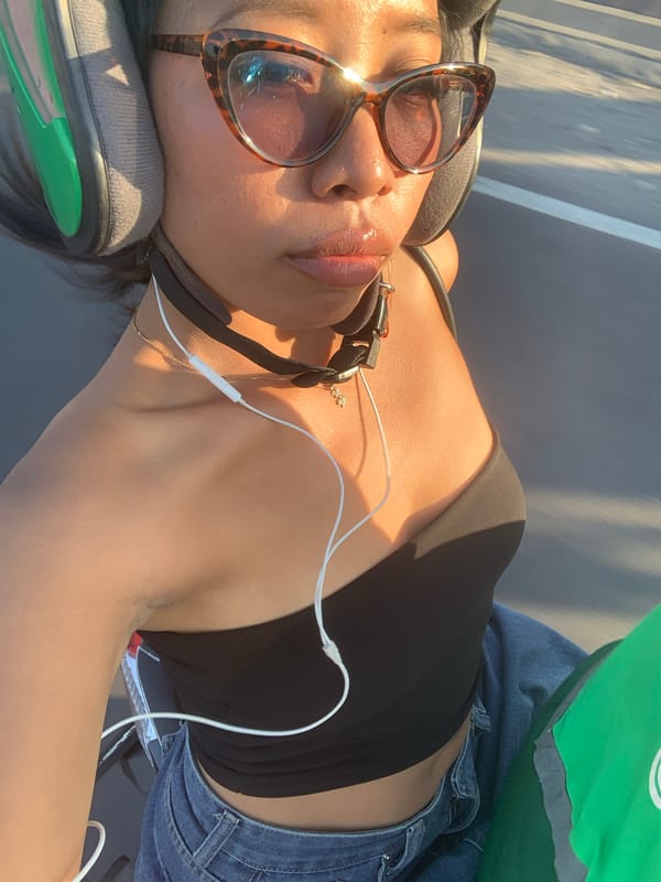 Helmeted selfie in golden Denpasar light, ready to ride.