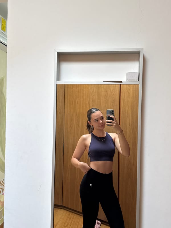 Woman takes mirror selfie in workout clothes in Mexico