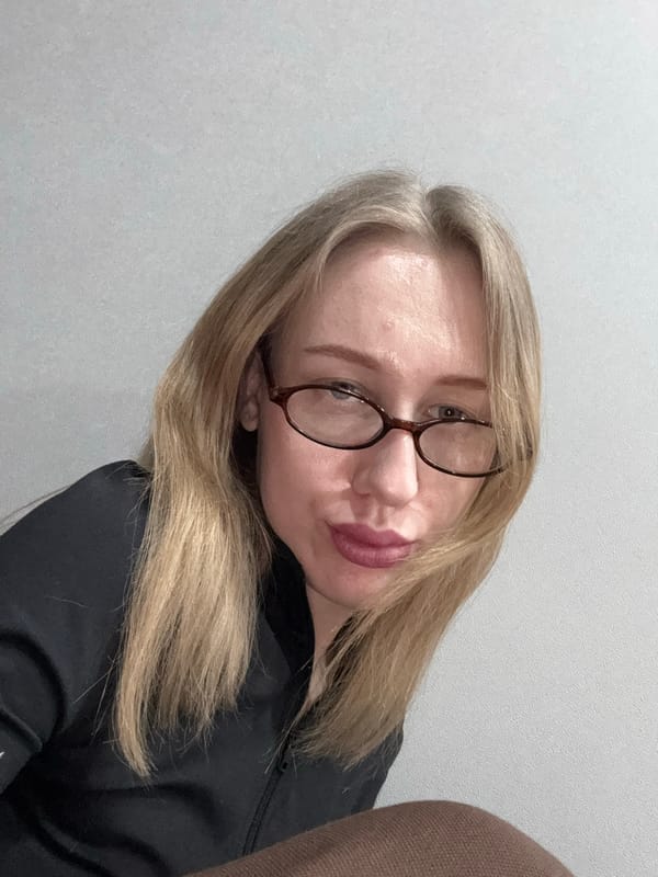 Woman takes multiple selfies indoors in Kuleshovka, Russia