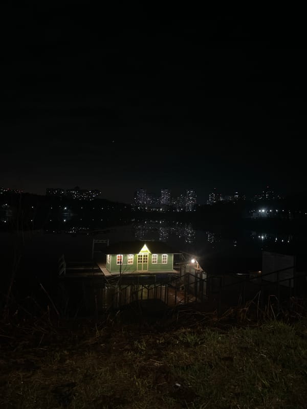 Nighttime scene captured in Ramenskoye showing illuminated waterfront building