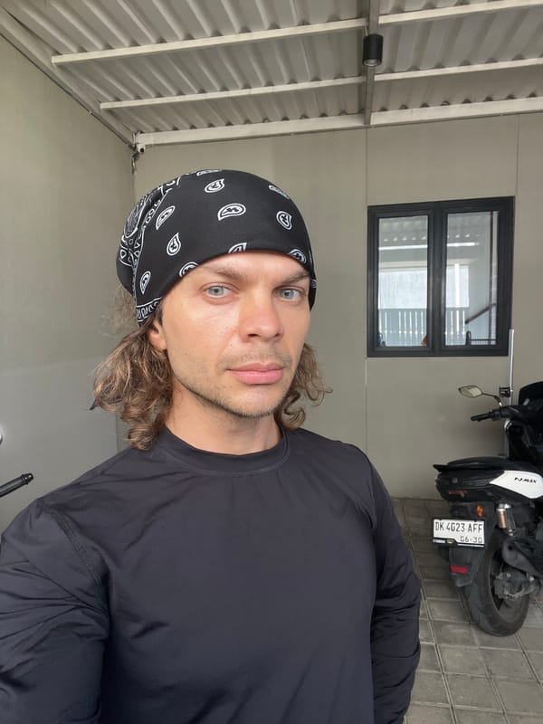 Man takes selfie with motorcycle in Mengwi, Indonesia