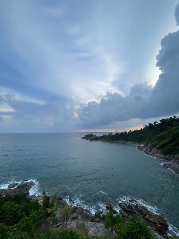Rocky coastline and island views along Rawai's shore