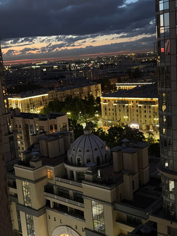 City skyline at dusk, then homemade syrniki in the kitchen