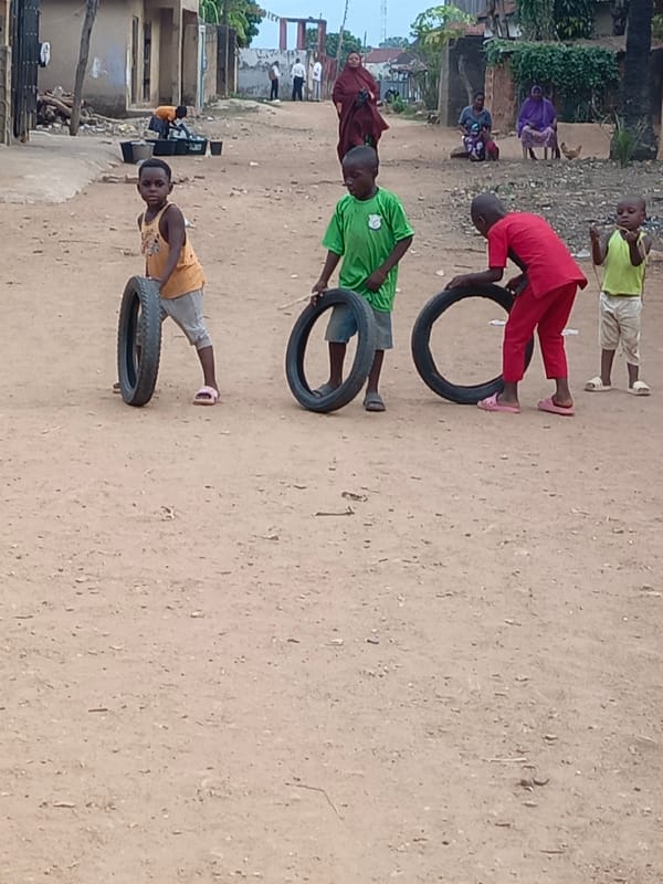 Boys play on street in Akwanga, Nigeria