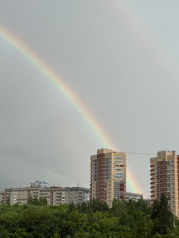 Double rainbow over Izhevsk apartment blocks after afternoon rain